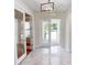 Bright entryway with double doors opening to a patio, and shiny floors at 28992 Gin Ln, Punta Gorda, FL 33982