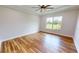 Bright bedroom with wood flooring and ceiling fan at 28992 Gin Ln, Punta Gorda, FL 33982