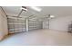 Two-car garage with epoxy flooring and high ceilings at 28992 Gin Ln, Punta Gorda, FL 33982