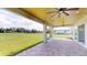 Covered patio with pavers and backyard view at 28992 Gin Ln, Punta Gorda, FL 33982