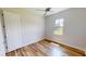 Bright bedroom with wood flooring, a window, and a closet at 28992 Gin Ln, Punta Gorda, FL 33982