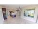 Open concept dining area with view of kitchen and backyard at 28992 Gin Ln, Punta Gorda, FL 33982