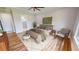 Main bedroom with en-suite bathroom and wood flooring at 28992 Gin Ln, Punta Gorda, FL 33982