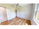 Spacious bedroom with wood floors, ceiling fan and a closet at 28992 Gin Ln, Punta Gorda, FL 33982