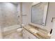 Elegant bathroom with marble tile, granite vanity, and soaking tub at 28992 Gin Ln, Punta Gorda, FL 33982