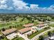 Aerial view of condo community near golf course and pool at 26366 Nadir Rd # 206, Punta Gorda, FL 33983