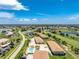 Community overview featuring pool, golf course, and homes at 26366 Nadir Rd # 206, Punta Gorda, FL 33983