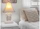 Bedroom detail showing a nightstand with a coastal-themed lamp at 1191 Manor Rd, Englewood, FL 34223
