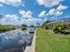 Scenic view of a peaceful canal with a private dock at 1191 Manor Rd, Englewood, FL 34223