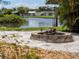 Fire pit area with sand and a waterfront view at 1191 Manor Rd, Englewood, FL 34223