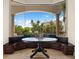 Charming breakfast nook with built-in seating offers picturesque views through large windows at 21321 Harborside Blvd, Port Charlotte, FL 33952