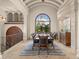 Dining room features elegant columns, a large arched window, and a formal dining set at 21321 Harborside Blvd, Port Charlotte, FL 33952