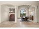 Dining room featuring elegant columns, a large arched window, and a formal dining set at 21321 Harborside Blvd, Port Charlotte, FL 33952