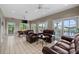 Spacious common area with leather sofas, chairs and a game table at 21321 Harborside Blvd, Port Charlotte, FL 33952