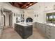 A spacious kitchen with marble countertops, stainless steel appliances, and a large central island at 21321 Harborside Blvd, Port Charlotte, FL 33952