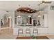 Bright kitchen boasts modern design with stainless steel appliances, an island with bar seating, and stylish pendant lighting at 21321 Harborside Blvd, Port Charlotte, FL 33952