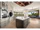 A spacious kitchen with marble countertops, stainless steel appliances, and a large central island at 21321 Harborside Blvd, Port Charlotte, FL 33952