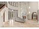 Living room with soaring ceiling, a marble fireplace, and expansive windows offering natural light at 21321 Harborside Blvd, Port Charlotte, FL 33952
