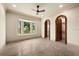 Bright bedroom with wood flooring and a large window, showcasing a view at 21321 Harborside Blvd, Port Charlotte, FL 33952