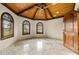 Spacious bedroom with high ceilings, hardwood floors, and arched windows at 21321 Harborside Blvd, Port Charlotte, FL 33952