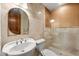 Elegant bathroom featuring a copper mosaic accent wall and a pedestal sink at 21321 Harborside Blvd, Port Charlotte, FL 33952