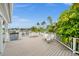Community patio overlooking the marina with white chairs and tables at 21321 Harborside Blvd, Port Charlotte, FL 33952