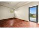Spacious bedroom with hardwood floors and private balcony access at 21321 Harborside Blvd, Port Charlotte, FL 33952