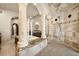 An elaborate shower with stonework, dual shower heads, and marble columns in the main bathroom at 21321 Harborside Blvd, Port Charlotte, FL 33952