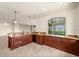 L-shaped bar with granite countertops and stainless steel appliances at 21321 Harborside Blvd, Port Charlotte, FL 33952