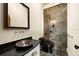 Stylish powder room with modern sink and dark-toned finishes at 21321 Harborside Blvd, Port Charlotte, FL 33952