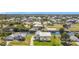 Home with canal access, boat dock, and lush green lawn at 24313 Pirate Harbor Blvd, Punta Gorda, FL 33955