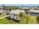 Two-story home with well-maintained lawn, boat dock, and canal access at 24313 Pirate Harbor Blvd, Punta Gorda, FL 33955
