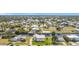 Two-story home with boat dock, canal access and lush green lawns at 24313 Pirate Harbor Blvd, Punta Gorda, FL 33955