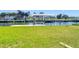 Green waterfront backyard with boat lift at 24313 Pirate Harbor Blvd, Punta Gorda, FL 33955