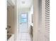 Bright bathroom featuring a shower, a vanity with storage, and a window at 24313 Pirate Harbor Blvd, Punta Gorda, FL 33955