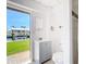 Bathroom view out to the canal with a gray vanity and tiled shower at 24313 Pirate Harbor Blvd, Punta Gorda, FL 33955