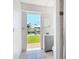 Bathroom view out to the canal with a gray vanity and tiled shower at 24313 Pirate Harbor Blvd, Punta Gorda, FL 33955