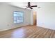 Bedroom featuring a closet, ceiling fan, and wood flooring at 24313 Pirate Harbor Blvd, Punta Gorda, FL 33955