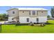 Two-story home with well-maintained lawn and canal access at 24313 Pirate Harbor Blvd, Punta Gorda, FL 33955
