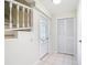 A welcoming foyer features tiled floors, stairs, and a closet for storage at 24313 Pirate Harbor Blvd, Punta Gorda, FL 33955