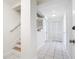 A well-lit foyer boasts stairs leading to the second floor and coat closet at 24313 Pirate Harbor Blvd, Punta Gorda, FL 33955
