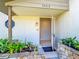 A covered front entrance displays landscaping and a welcoming entry door at 24313 Pirate Harbor Blvd, Punta Gorda, FL 33955