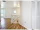 A hallway features laminated wood flooring and a closet at 24313 Pirate Harbor Blvd, Punta Gorda, FL 33955