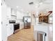 Modern white kitchen featuring marble countertops and stainless steel appliances at 24313 Pirate Harbor Blvd, Punta Gorda, FL 33955