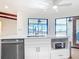 Kitchen island with stainless steel appliances and ample storage space at 24313 Pirate Harbor Blvd, Punta Gorda, FL 33955