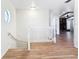 Upper landing area features wood floors and a railing at 24313 Pirate Harbor Blvd, Punta Gorda, FL 33955