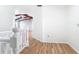 A second-floor landing shows wood laminate and a view to the living room at 24313 Pirate Harbor Blvd, Punta Gorda, FL 33955