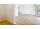 A spacious living room boasts laminated wood flooring and natural light at 24313 Pirate Harbor Blvd, Punta Gorda, FL 33955