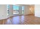Spacious living room featuring large windows and light wood floors at 24313 Pirate Harbor Blvd, Punta Gorda, FL 33955