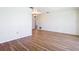 A bright living room features laminated wood flooring and neutral color palette at 24313 Pirate Harbor Blvd, Punta Gorda, FL 33955